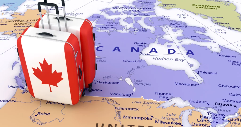 photo d'une carte du canada avec des valises décorées du symbole du Canada