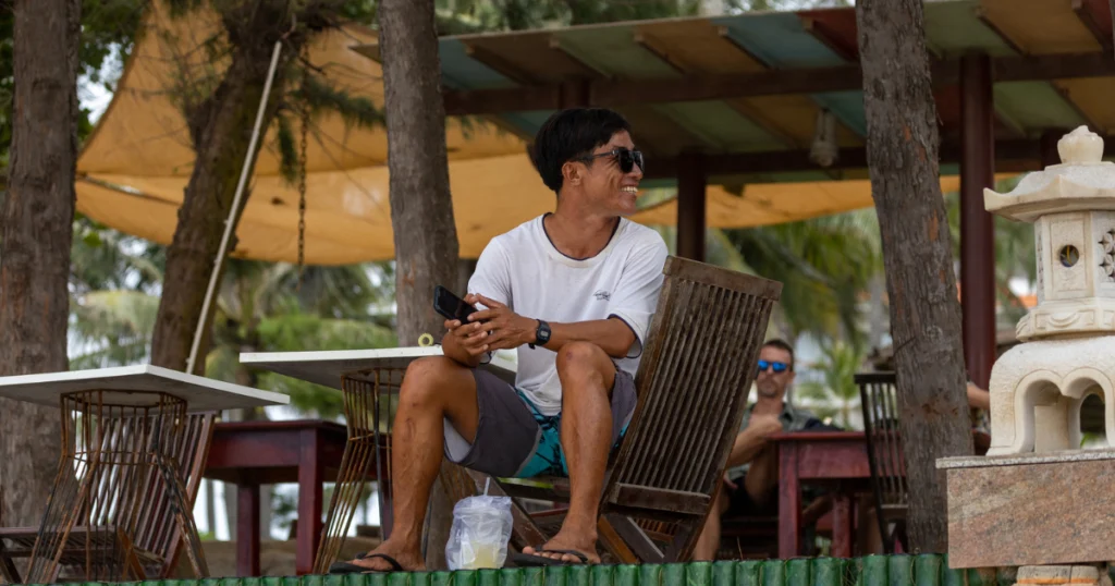 photo of a person traveling in the caribbean and using the internet